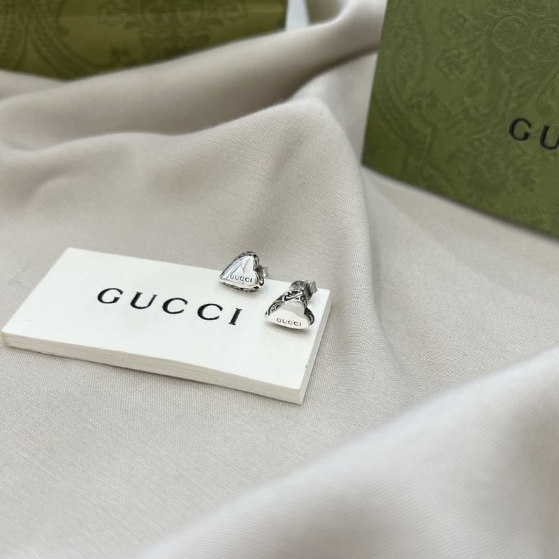 G*u*i earrings